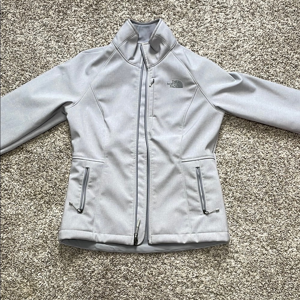 The North Face Gray Ski Jacket with High Collar and Fitted Silhouette